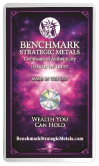 A rectangular Benchmark Strategic Metals Certificate of Authenticity card with a purple and pink cosmic background, featuring the Statue of Liberty logo at the top and the text 'IN GOD WE TRUST' and 'MADE IN THE USA'.